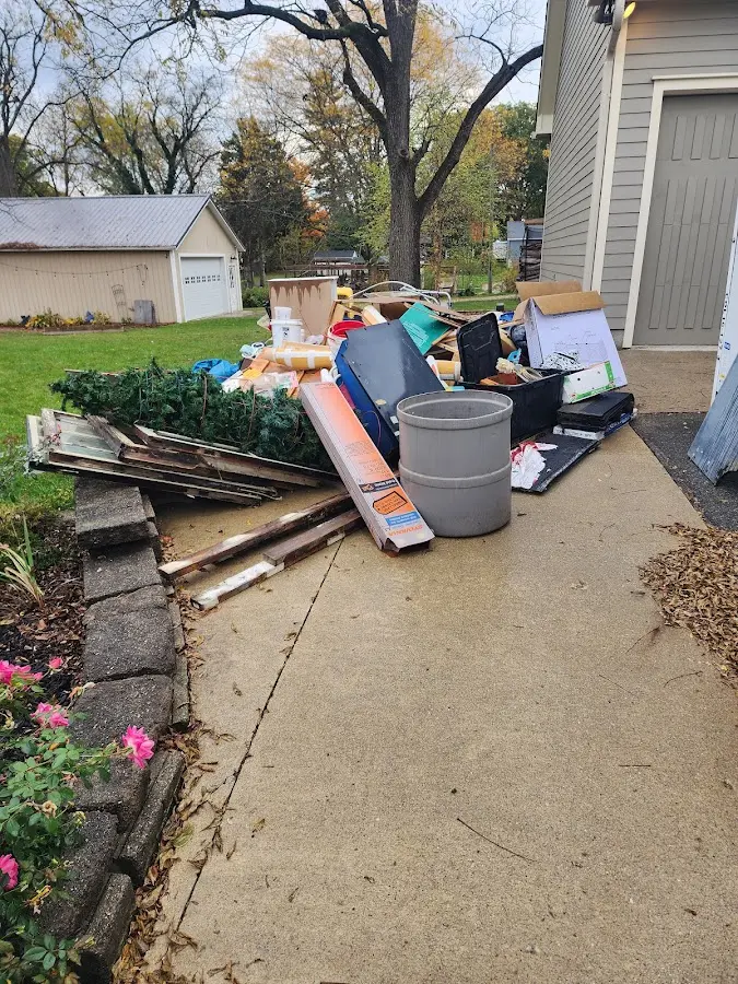 Dumpster being loaded with debris for 30 Yard Dumpster Rental in Safety Harbor